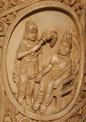 Suddhodna seated on a throne Roundel 2 ivory tusk.jpg