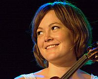 Sara Watkins holding a fiddle