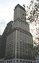 Montague–Court Building, a high-rise building clad in stone, viewed from street level