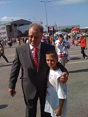 Guntis Ulmanis with young Dinamo Riga fan in 2013.