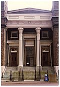 Photograph of the front steps, doors, and façade of Old First Presbyterian Church, showing Egyptian revival details.