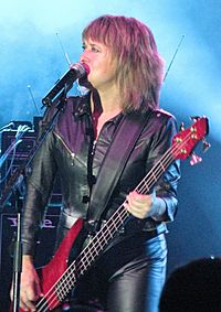 Suzi Quatro plays a bass guitar while she sings at AIS Arena