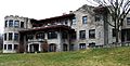 A very large stone house with many windows