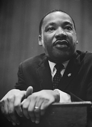 Martin-Luther-King-1964-leaning-on-a-lectern