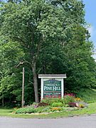 Main entrance sign and garden