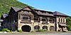 View of the stone and wood Bear Mountain Inn after renovations.