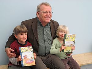 Geoffrey Hayes artist with two kids (partially blurred).jpg