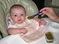 Baby eating baby food