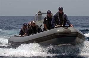 US Navy 040506-N-7586B-314 Sailors assigned to boarding team from the New Zealand frigate HMNZS Te Mana (F 111) man a Rigid Hull Inflatable Boat (RHIB) to conduct a search of fishing dhows in the area