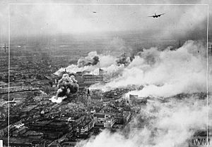 Operation OYSTER - Douglas Bostons fly over the burning Emmasingel lamp and valve factory at the height of the raid.jpg