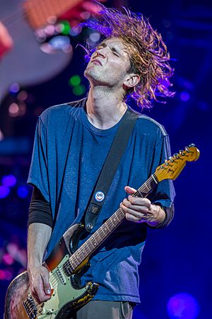 Klinghoffer playing guitar onstage