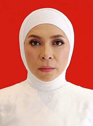 Head shot of Goeslaw in front of a red background