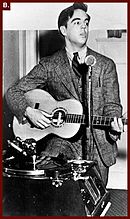 Young Alan Lomax, playing the guitar