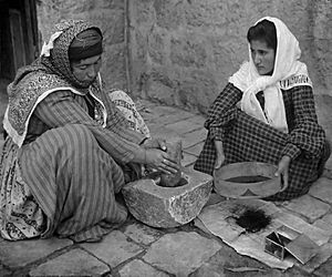 Palestinian women grinding coffee beans