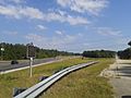 Freedom Riders state historic marker, field of bus burning in distance behind