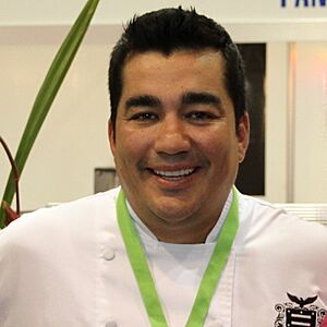 Garces wearing a white shirt, smiling