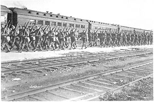 Personnel of the Winnipeg Grenadiers board a Canadian Pacific troop train