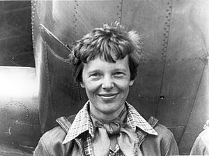 Amelia Earhart standing under nose of her Lockheed Model 10-E Electra, small.jpg