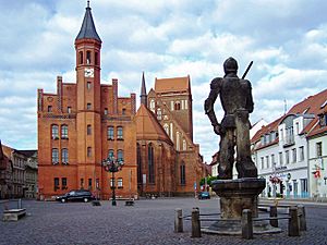 Market place of Perleberg with town hall, St James's church and Roland statue