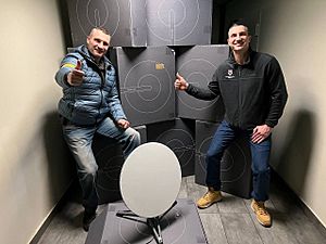 Wladimir and Vitali Klitschko with a Starlink user terminal