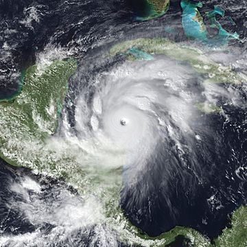 Satellite image of an intense tropical cyclone over the Western Caribbean Sea with an large and well defined eye.