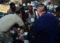 US Navy 100119-N-7948C-048 A Haitian woman screams in pain as U.S. military medical personnel try to set her broken leg at a clinic at the Killick Haitian Coast Guard Base