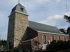 Religious building in stone and brick in Romanesque and Neo-Romanesque style.