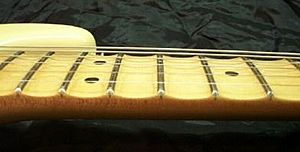 Scalloped fretboard