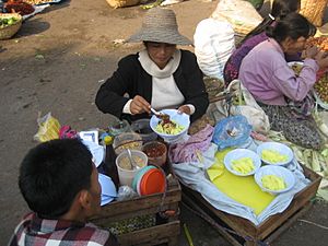 Street vendor preparing tofu salad