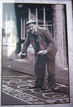 Man Sanding the street in Knutsfrod for May Day 1920