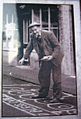 Man Sanding the street in Knutsfrod for May Day 1920