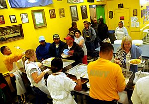 US Navy 090806-N-6220J-004 Sailors and Navy Delayed Entry Program members serve breakfast to homeless men and women at Dorothy's Soup Kitchen in Salinas, Calif. during Salinas Navy Week community service event