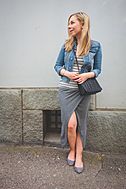 Young woman in marinière, denim jacket en wrap skirt