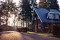 Brown house blue roof (Unsplash)