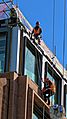 Construction workers on Distaff Lane building site, City of London England