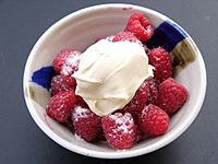 Raspberries with crème fraîche and sugar