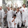 4 year old Fraz Wahlah, with his father MS Wahlah behind him, holding Peoples Party flag & leading an MRD protest against General Zia's martial law shortly before his arrest making him youngest prisoner of the military dictator