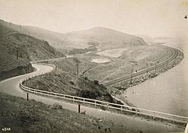 View north from Sierra Point from approximately 1915, showing the Bayshore Highway crossing over Tunnel 5 of the Bayshore Cutoff. The Cutoff is the rail line along the western shoreline of San Francisco Bay.