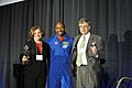 Astronaut Leland Melvin presents the Levines with award