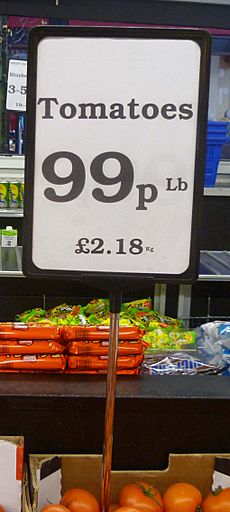 Tomatoes for sale in a UK greengrocer's shop 2013