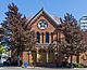 The red brick front facade of the synagogue