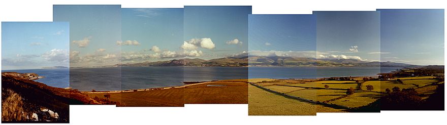 Panorama from Pendament old Deer Park across the Menai Strait  with Snowdome in the background.