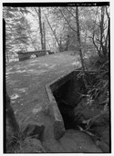 VIEW LOOKING NORTH AT REMAINS OF RUCKEL CREEK BRIDGE NEAR EAGLE CREEK. - Historic Columbia River Highway, Troutdale, Multnomah County, OR HAER ORE,26-TROUT.V,1-76.tif