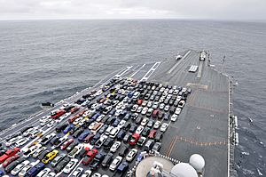 US Navy 120109-N-EE987-022 The aircraft carrier USS Ronald Reagan (CVN 76) transports Sailors' vehicles while transiting the Pacific coast to Naval