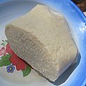 Individual plate of garri to eat by hand with fish and greens, Baba1 (5570984125).jpg