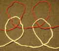 Knitting plaited stitches