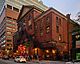 Exterior view of main entrance and neon signage of Massey Hall at night