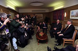 President Bill Clinton participates in a meeting with Protestant Religious leader Ian Paisley at Queens University in Belfast