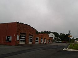 Storefronts and houses along Leesburg Pike in Dranesville