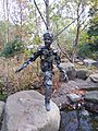 Statue of a child made of vines in the Memphis Botanic Garden